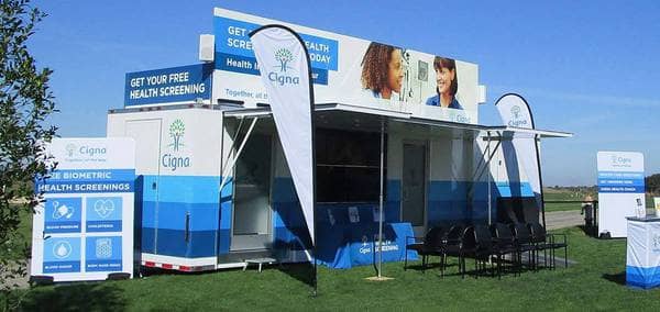 A mobile health care clinic branded with the Cigna logo.